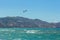 13.07.2014. Greece. Heraklion. Two persons of the surfer ride a kite. Two domes highly in the clear blue sky. Windy weather