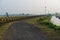 13.11.2022 . Radhikapur, West Bengal, India. black asphalt road beside international border between India and Bangladesh country