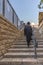 134/5000 Israel-Jerusalem 12-05-2019 View of a stone staircase that leads to the wailing wall where an ortodox jewish man walks u