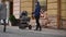 14.11.2017 Chernivtsi, Ukraine - young beautiful father with stroller is walking on the street