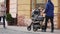 14.11.2017 Chernivtsi, Ukraine - young beautiful father with stroller is walking on the street