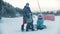 14-12-19 RUSSIA, KAZAN: Family snowboarding - A man with prosthetic leg teaching his kids how to get on the snowboard
