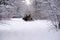 14.12.2021. Heavy snowfall in Moscow. Snowcat ratrak rides up the hill and preparation ski slope