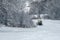 14.12.2021. Heavy snowfall in Moscow. Snowcat ratrak rides up the hill and preparation ski slope