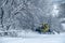 14.12.2021. Heavy snowfall in Moscow. Snowcat ratrak rides up the hill and preparation ski slope