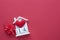 14 February wooden house calendar on a red heart background. Happy Valentineâ€™s Day top view card