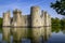 14th century Bodium castle surrounded by a moat in the County of Sussex in England.