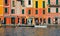 15.03.2018. facade of colorful old buildings and architecture with people walking on dock in small coastal village Portofino in Li