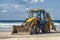 15/12/2018 Israel, Netanya, the driver of the excavator runs a bucket of manipulator, performs the repair of a public beach on a s