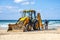 15/12/2018 Israel, Netanya, the driver of the excavator runs a bucket of manipulator, performs the repair of a public beach on a s