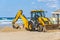 15/12/2018 Israel, Netanya, the driver of the excavator runs a bucket of manipulator, performs the repair of a public beach on a s