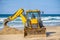 15/12/2018 Israel, Netanya, the driver of the excavator runs a bucket of manipulator, performs the repair of a public beach on a s