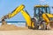 15/12/2018 Israel, Netanya, the driver of the excavator runs a bucket of manipulator, performs the repair of a public beach on a s