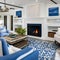 15 A beachy, coastal-inspired living room with a mix of blue and white upholstery, a large fireplace mantle with coastal decor,