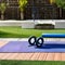 15 An outdoor workout area with exercise equipment, a yoga mat, and a water fountain4, Generative AI