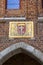 15th century Mariacka Gate by the river Motlawa, arms on the facade, Gdansk, Poland