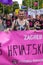 15th Zagreb pride. LGBTIQ activists holding pride banner.