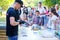 16 September 2017 Ukraine, White Church. Children are watching the process of caramel cooking outdoors