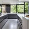 16 A sleek, modern kitchen with a mix of white and stainless steel finishes, a large island with seating, and a mix of open and