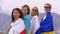 17-04-2022 TURKEY, ISTANBUL: women wrapped in the flags of Kazakhstan, Ukraine, Russia and Belarus looks in the camera