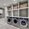 17 A laundry room with a mix of white and gray finishes, a large, built-in drying rack, and a mix of open and closed storage1, G
