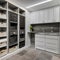 17 A laundry room with a mix of white and gray finishes, a large, built-in drying rack, and a mix of open and closed storage5, G