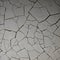 1789 Cracked Concrete Texture: A textured and weathered background featuring cracked concrete texture with rugged patterns and a