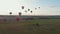 18-07-2019 Suzdal, Russia: different colorful air balloons are taking off over the field - early evening