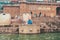 18.12.2019, Varanasi, India. A yogi sits on a pier by the river Ganges and meditates