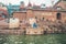 18.12.2019, Varanasi, India. A yogi sits on a pier by the river Ganges and meditates. Outdoor