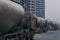 18 Dec,2014,Beijing,China, Vacuum truck riding on the road beside the unfinished buildings