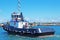 An 18 meter Commercial Tug Boat under way in Gladstone Marina Harbour. Queensland, Australia