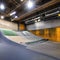 182 A contemporary urban skate park with sleek ramps, vibrant street art, and a vibrant atmosphere, attracting skateboarders and