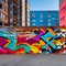 1852 Urban Graffiti Wall: A vibrant and urban background featuring a graffiti-covered wall with street art, vibrant colors, and