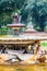 18th century Fontana dei Cavalli Marini stands in the middle of a round plaza surrounded by trees and walkways at Via Pinciana