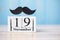 19 November Calendar and mustache on wood table background. Father, International men day, Prostate Cancer Awareness and World