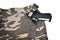 1911 semi automatic handgun in camouflage pant pocket white back