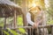 1920s Dressed Romantic Couple Kissing in a Wooded Forest