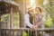 1920s Dressed Romantic Couple on Wooden Bridge