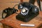 1930s to 1950`s black telephone with rotary dial.