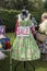 1940s style green floral dress with sale sign on a mannequin on outdoor market stall vendor