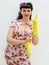 1950s retro style woman putting on yellow rubber gloves.