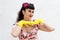 1950s retro style woman wearing yellow rubber gloves.