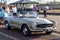 1960,s Mercedes classic car, an immaculate gold Mercedes SL 250 convertible gleaming in the afternoon sunshine