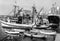 1964, Italy, Torre del Greco - An old fishing boat is anchored in the harbor