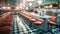 1970\\\'s retro style diner with checkered floor and red stools. Empty business with no people