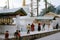 1977. India. Tibetan pilgrims and children by the praying mills.