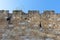 198/5000 Israel Jerusalem, view of the old city wall, photographed from below with the background on the wall against a bright blu