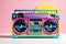 1980s Style Boombox with Vibrant Hues of Neon Pink, Electric Blue, and Sunburst Yellow - Cassette Deck