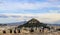 19th century Chapel of St. George on Mount Lycabettus viewed over the rooftops of Athens from the Acropolis with silhouettes o